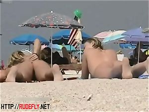 light-haired model nudist on the bare beach spycam flick